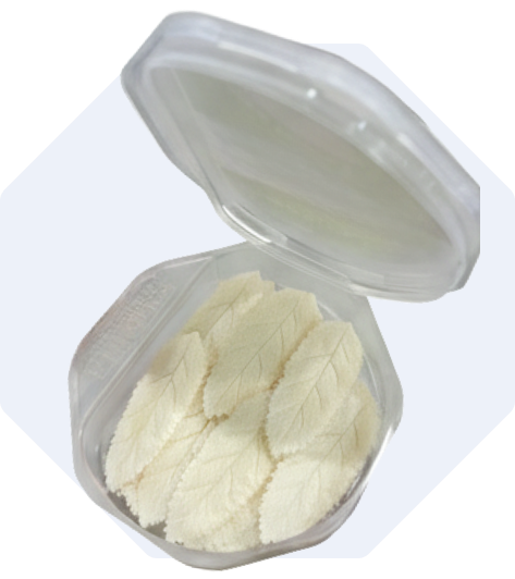 An open box of Nicleaf pouches on a light blue background